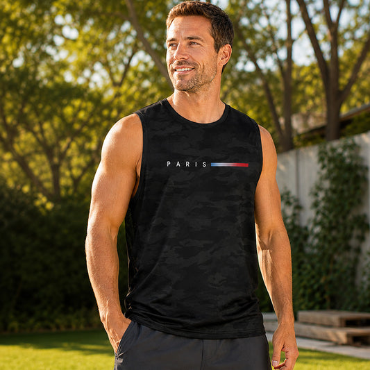Man wearing black camouflage PARIS print sleeveless tank top outdoors in natural sunlight, athletic fit, relaxed posture